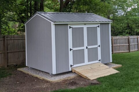 garden shed from 5 Star Buildings in Missouri, gray and white shed with a wood ramp