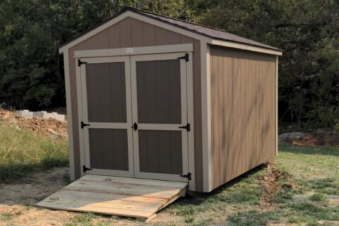 a brown garden shed with a wood ramp provided by 5 Star Buildings in Missouri